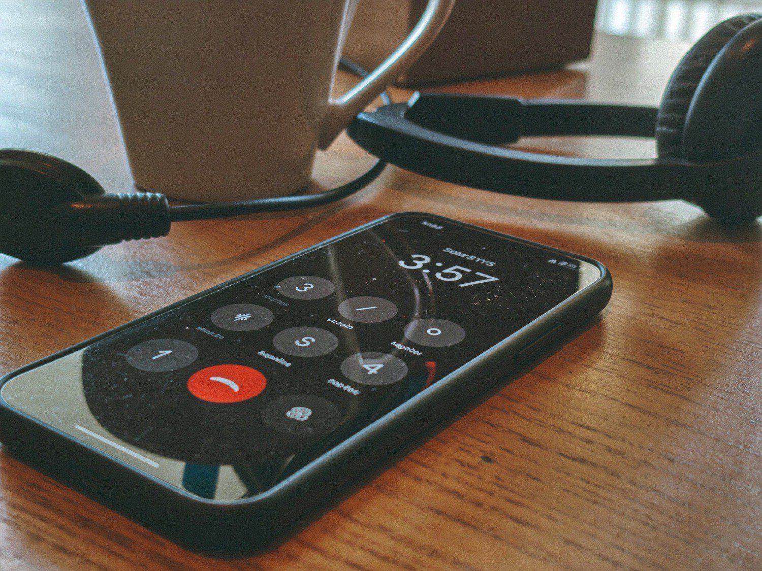 A phone on a quiet workbench after hours
